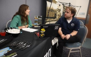 student meets with local employer