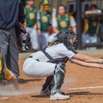 Catcher Bekah Mueller attempting to get an out at home plate