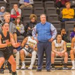 Head coach Rob Edmisson watches the Griffons run defense