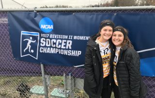 Sydney Cluck and Paige Phipps posing for a photo in 10 degree weather after their final game of the season. They finished with 17 wins, 5 losses and 0 ties.